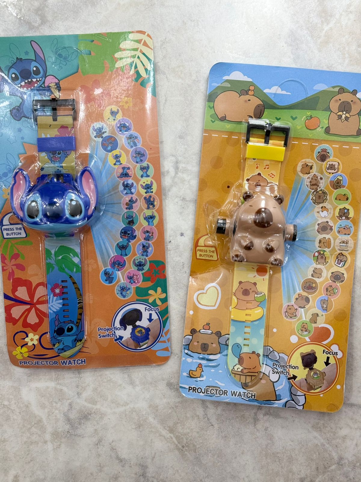 RELOJ PROYECTOR CAPIBARA Y STICH
